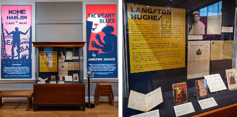 From the Harlem Renaissance exhibition: large silkscreens of the book covers of Claude McKay's 'Home to Harlem' and Langston Hughes' 'The Weary Blues' cover two windows. Between them is an exhibition case featuring books and papers by Langston Hughes.